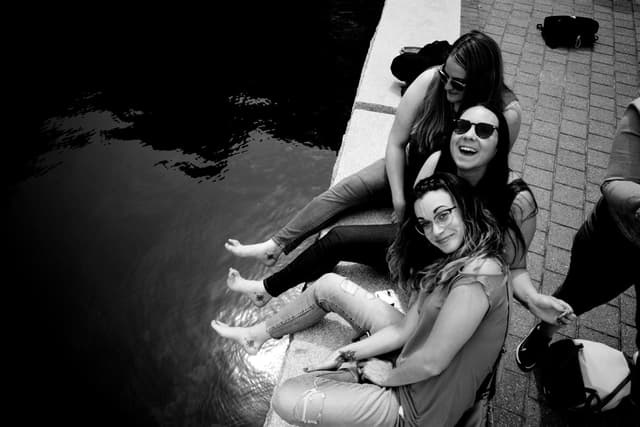 cousins sitting at boston waterfront